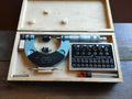 Blankenhorn 25–50 mm thread micrometer in an open wooden case with accessories and a metric and Whitworth thread chart.
