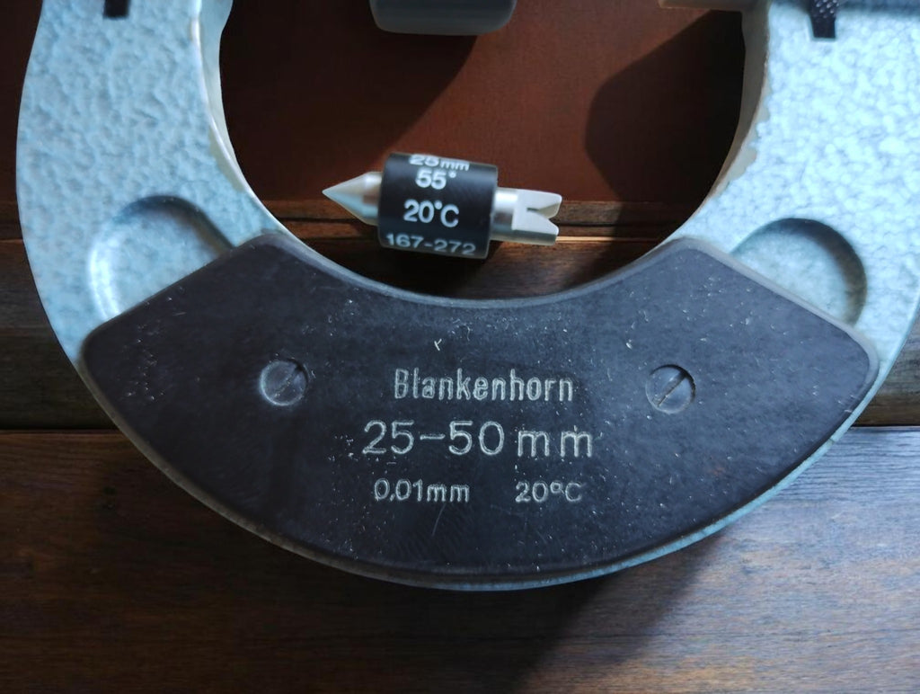 Close-up of the Blankenhorn thread micrometer marked 25–50 mm, 0.01 mm and 20°C, with a loose 55-degree measuring insert.
