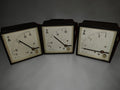 Three vintage EAW Berlin-Treptow AC ammeters with pale dials, black pointers and dark square frames, front view
