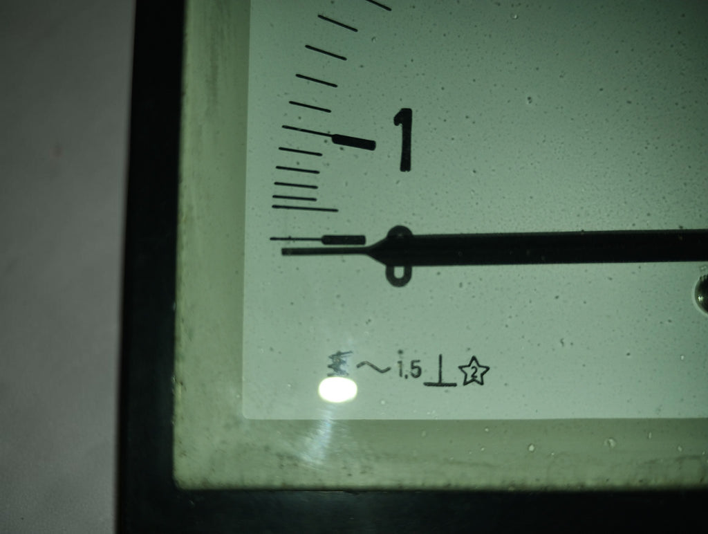 Close-up of an EAW Berlin-Treptow ammeter dial showing scale markings, pointer and electrical symbols
