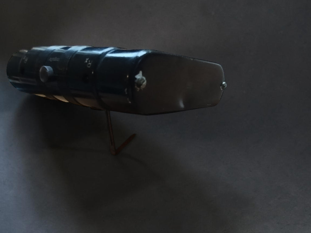 Side view of the vintage Gossen Post megohmmeter showing the housing and leather case.
