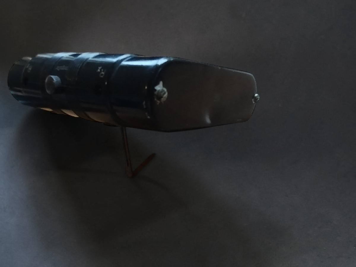 Side view of the vintage Gossen Post megohmmeter showing the housing and leather case.
