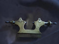Antique brass Jacot pivot tool frame with two steel runners and wooden handles, reverse view
