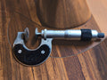 Vintage Steinmeyer 0–25 mm disc micrometer with round measuring faces and a black frame
