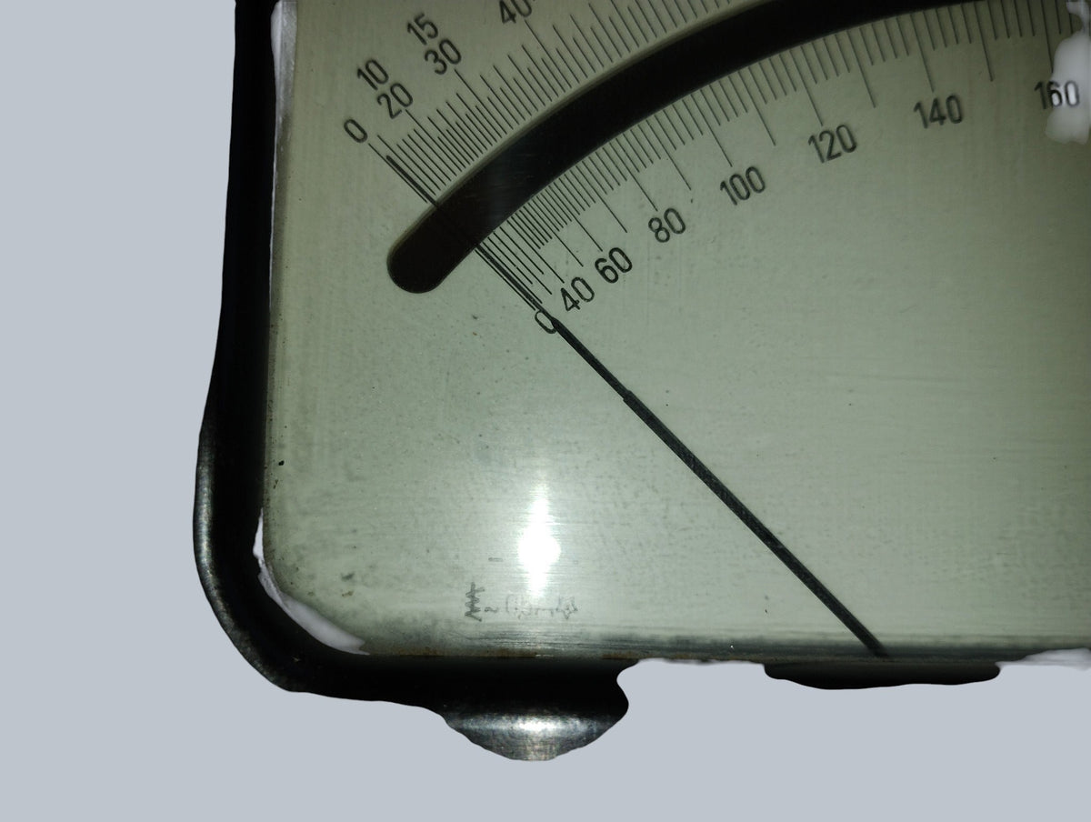 Close-up of the Gossen voltmeter needle and lower end of the graduated voltage scales.
