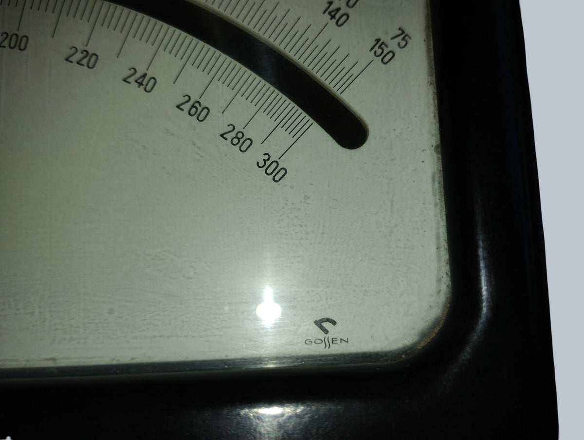 Gossen logo and upper ends of the voltage scales on the vintage analog voltmeter dial.
