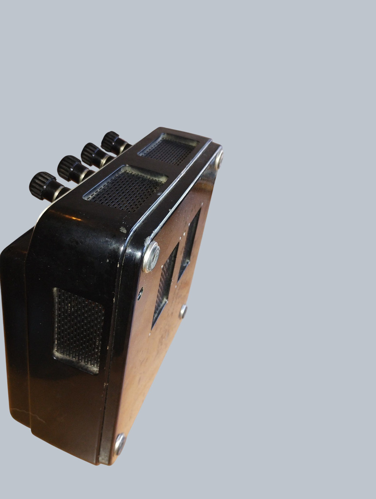 Angled side view of the Gossen voltmeter showing ventilation grilles, terminals and black housing.
