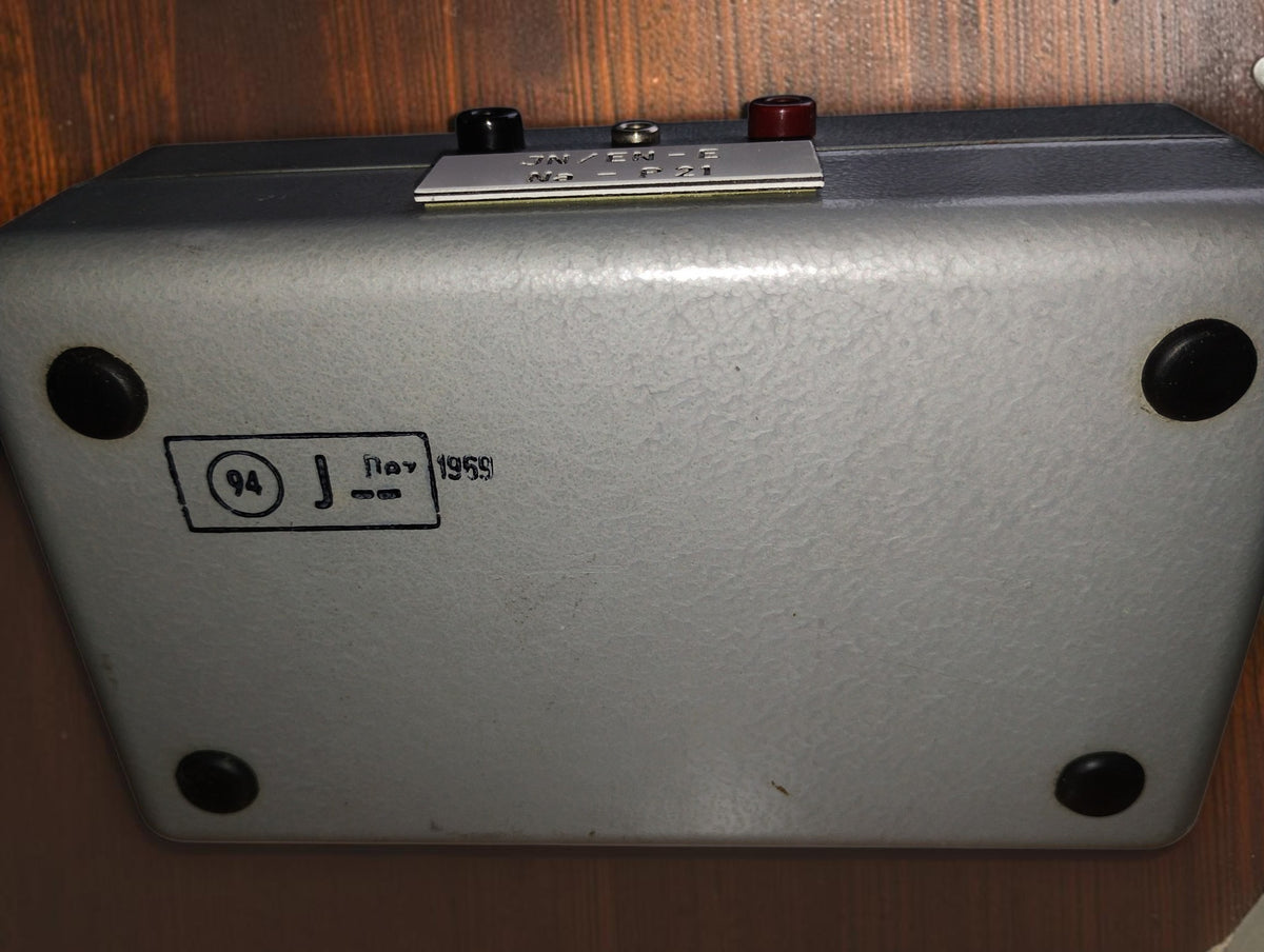 Underside of the RESITEST contact tester with four black feet and a stamp bearing the year 1959
