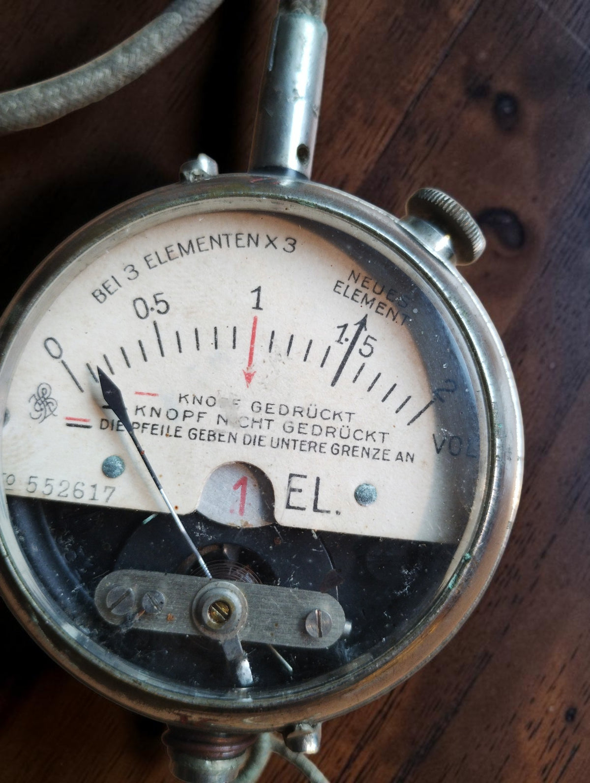 Siemens & Halske battery tester dial with S&H monogram, voltage scale, German markings and analog pointer.
