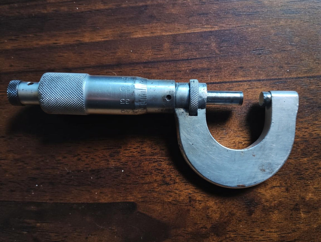 Rear view of the Steinmeyer outside micrometer showing the measuring spindle, graduated thimble and metal frame
