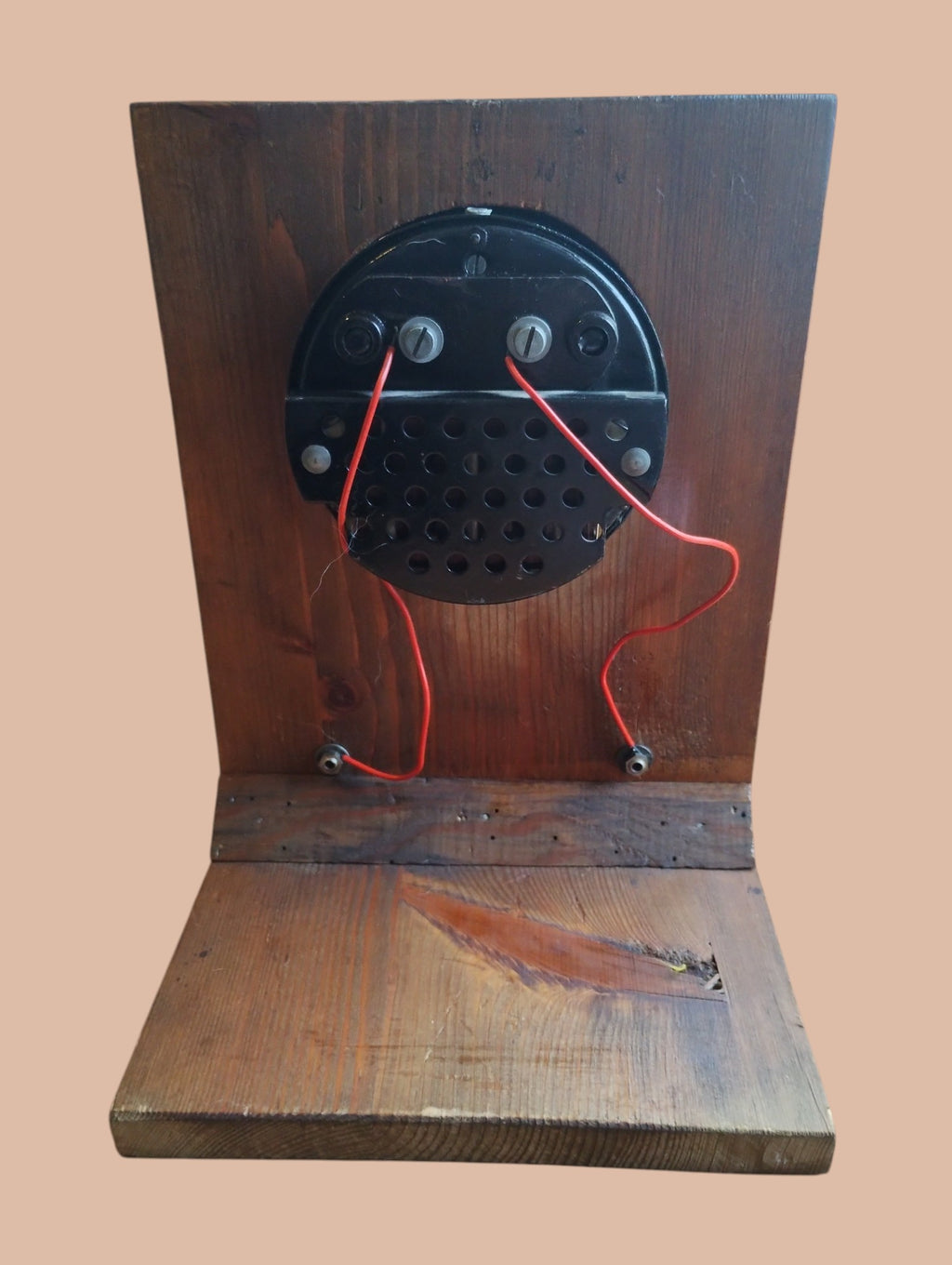 Rear view of the Hartmann & Braun voltmeter with terminal connections, red wiring, and wear to the wooden base
