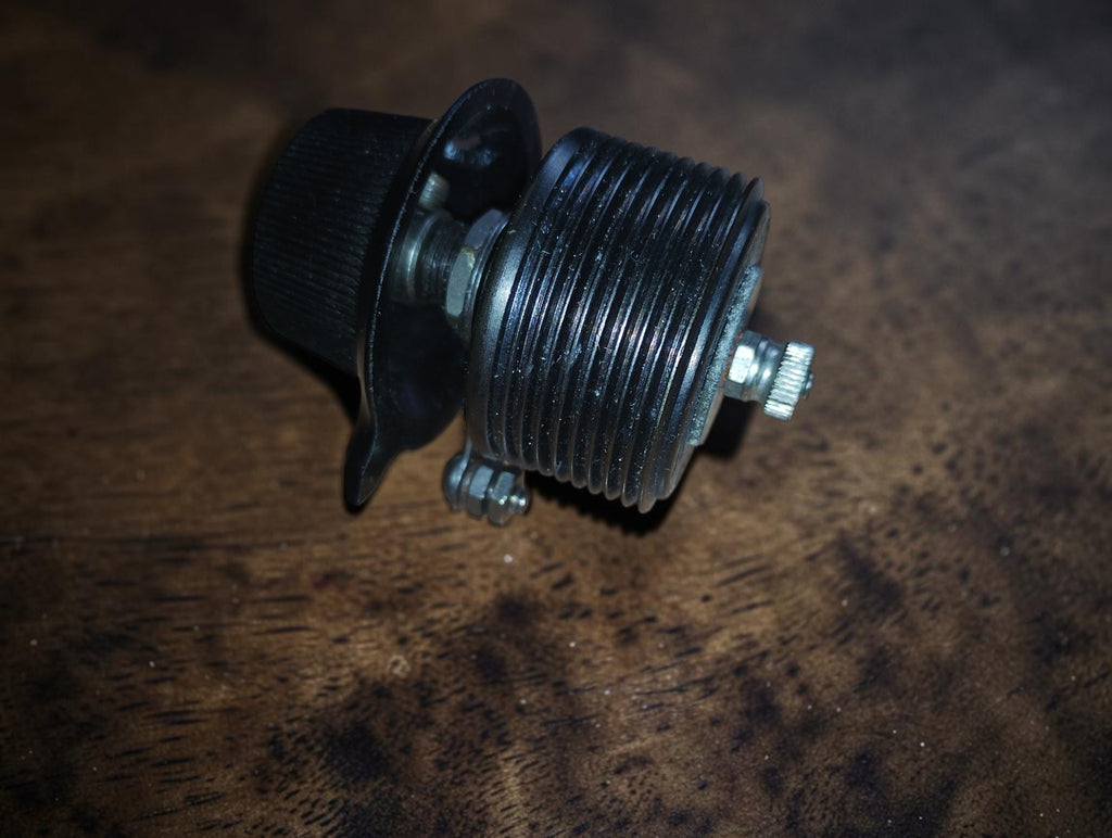 Side view of the PILOT Resistograd variable resistor showing the ribbed housing, adjustment knob and mounting hardware.
