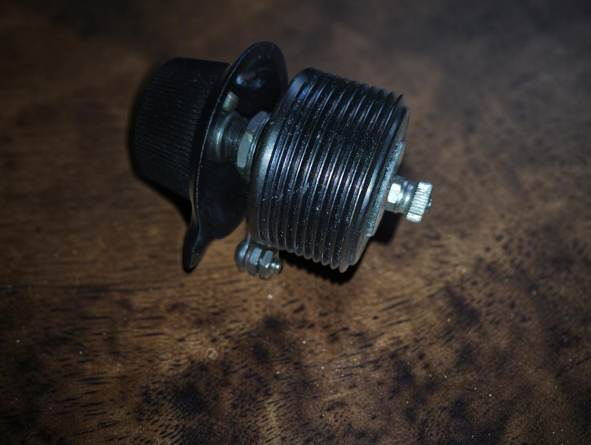 Side view of the PILOT Resistograd variable resistor showing the ribbed housing, adjustment knob and mounting hardware.
