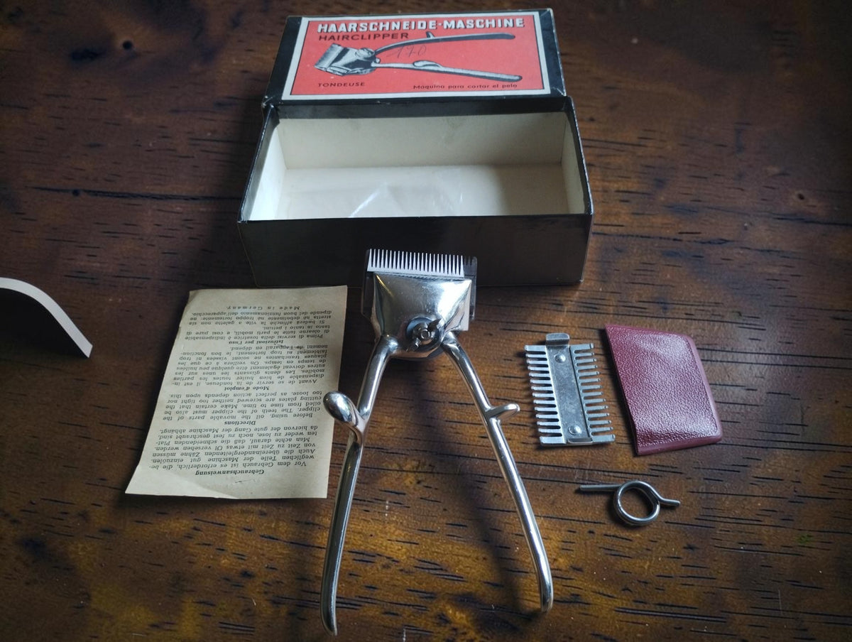 Éclair No. 170 manual hair clipper set with original box, multilingual instructions, and accessories
