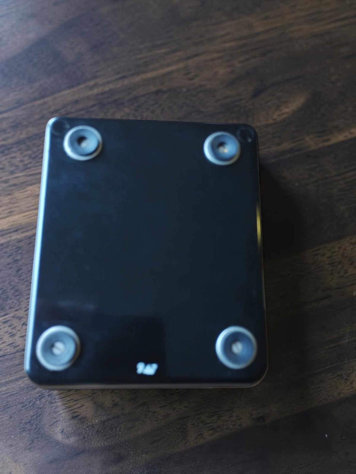 Underside of the vintage Gossen analog meter with a black base and four round feet
