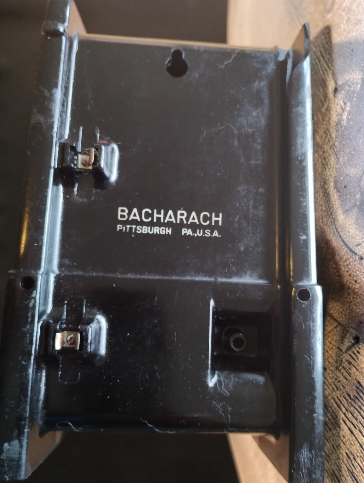 Rear view of the Bacharach Model MZF pressure gauge showing mounting holes, fittings and the Bacharach Pittsburgh PA U.S.A. marking.
