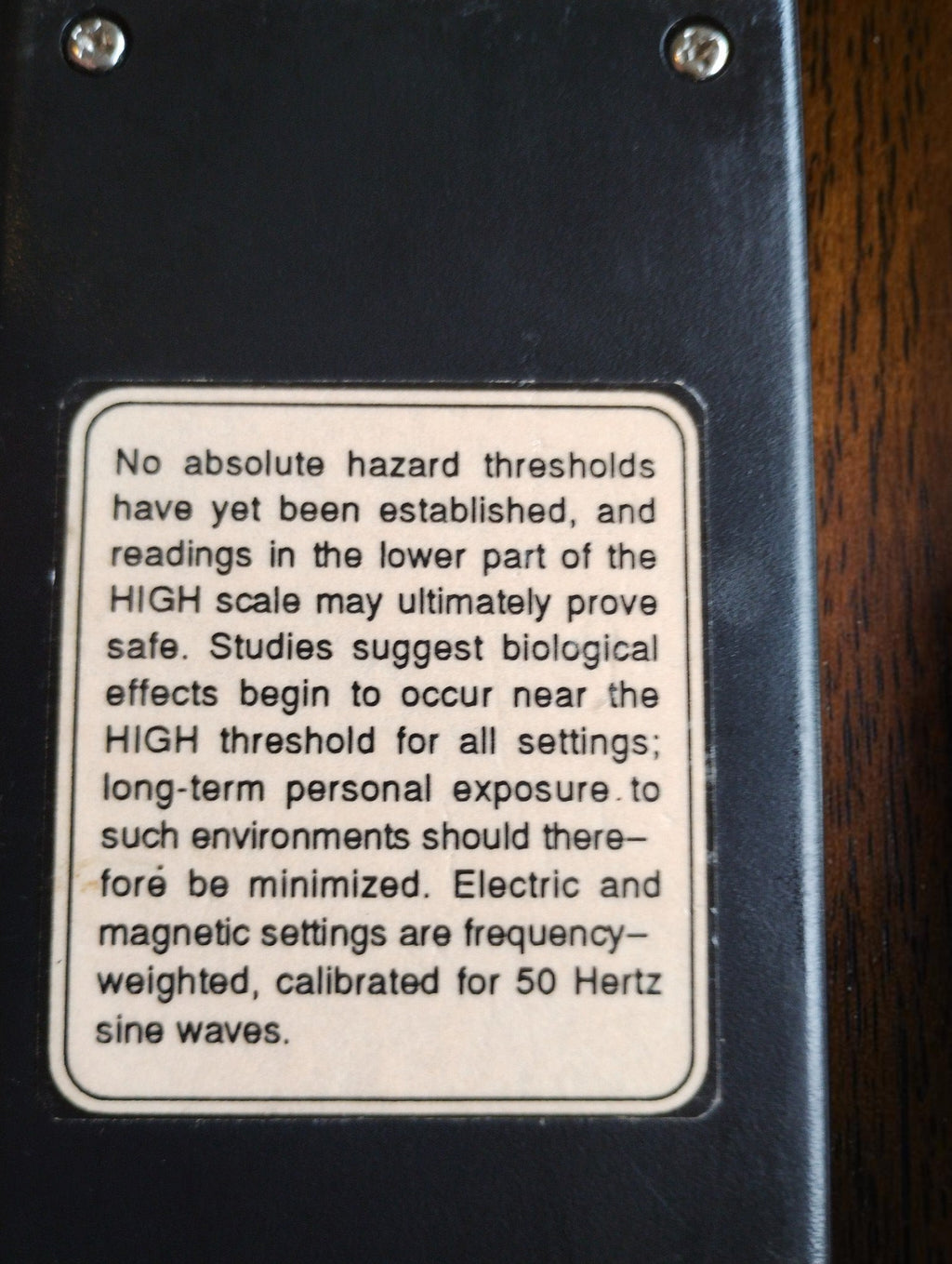 Rear label on the TriField Meter stating 50 Hz sine-wave calibration for the electric and magnetic settings
