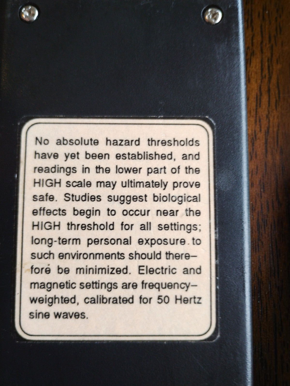 Rear label on the TriField Meter stating 50 Hz sine-wave calibration for the electric and magnetic settings
