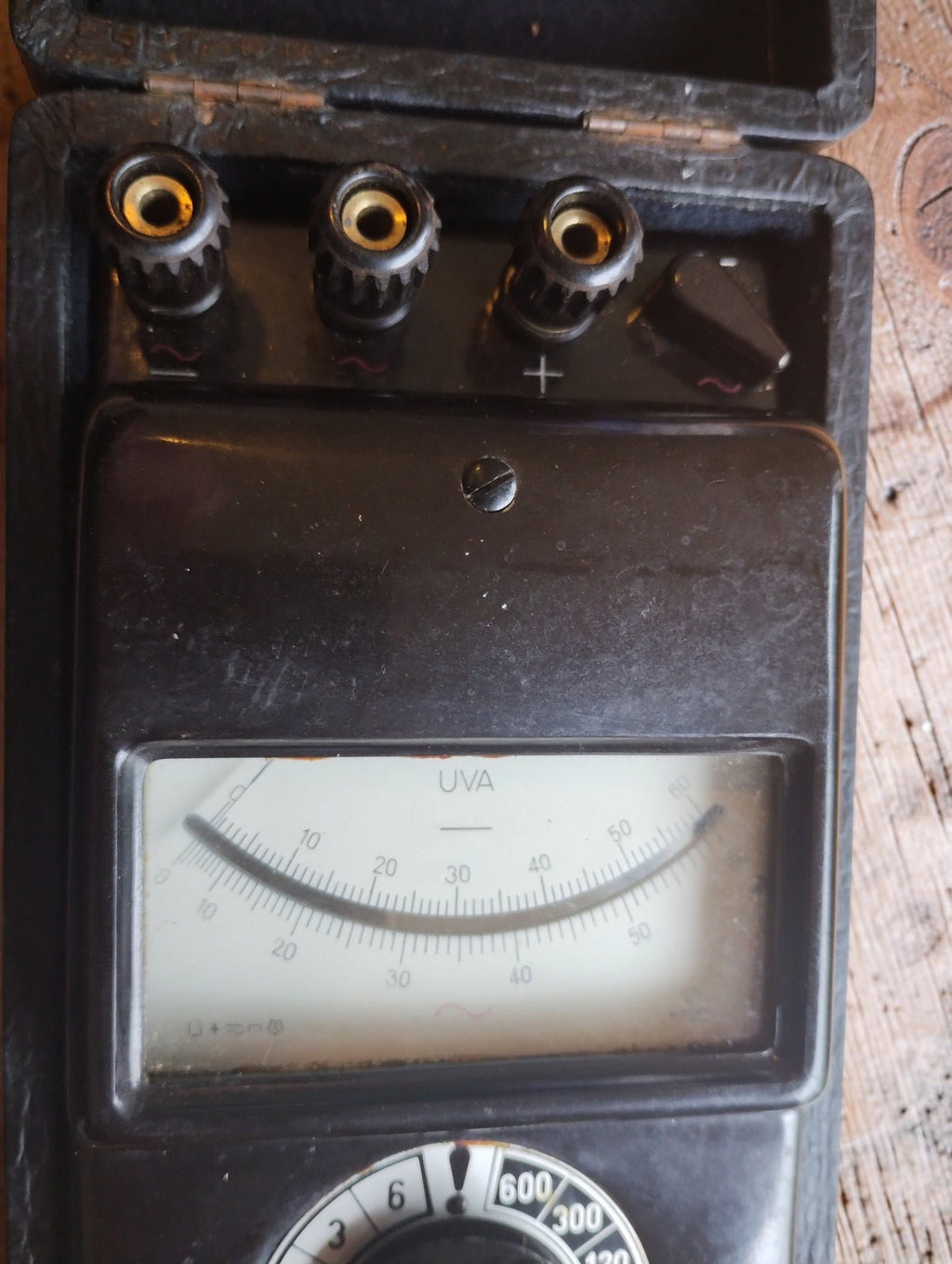 Close-up of the analog scale and three connection terminals of the vintage Gossen UVA meter

