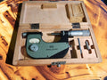 VIS MMCc 25-50 outside micrometer with accessories in an open wooden storage case.
