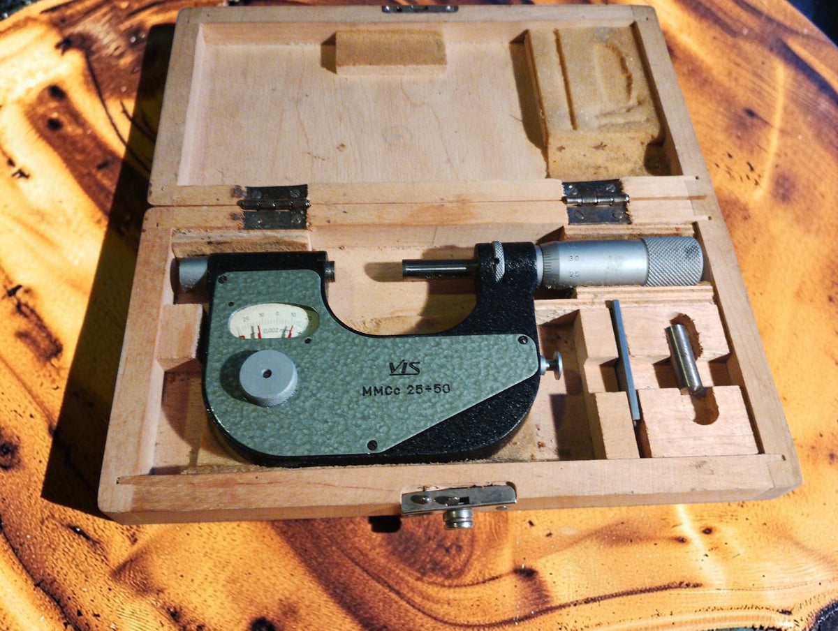 VIS MMCc 25-50 outside micrometer with accessories in an open wooden storage case.
