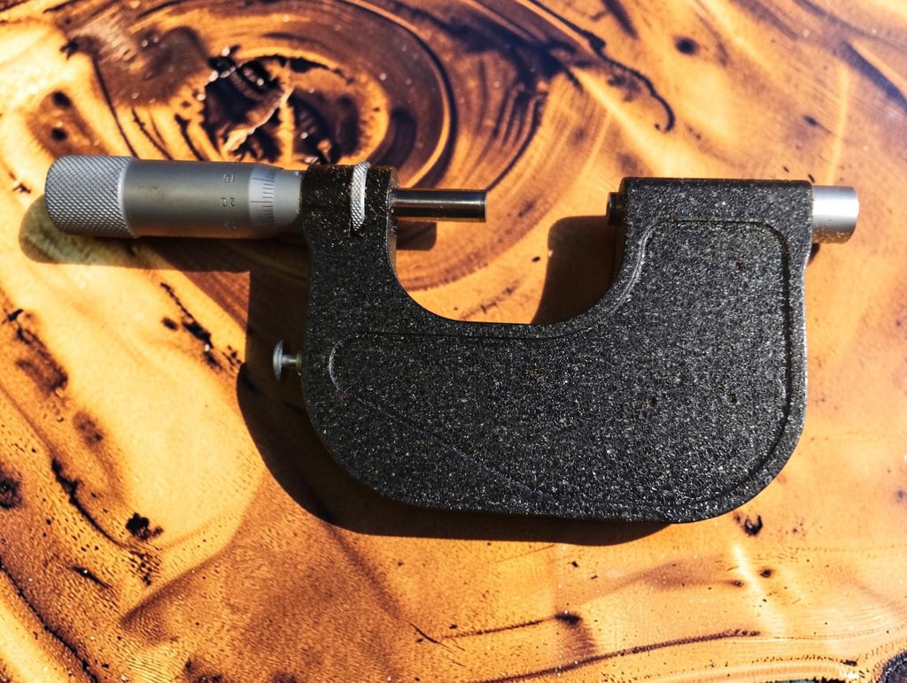 Rear view of the VIS MMCc 25-50 outside micrometer showing the black frame and micrometer spindle.
