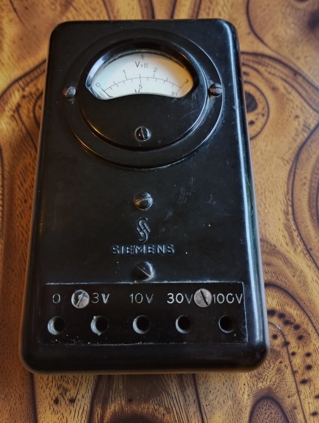 Siemens & Halske vintage analog voltmeter with black housing and terminals marked 3 V, 10 V, 30 V and 100 V
