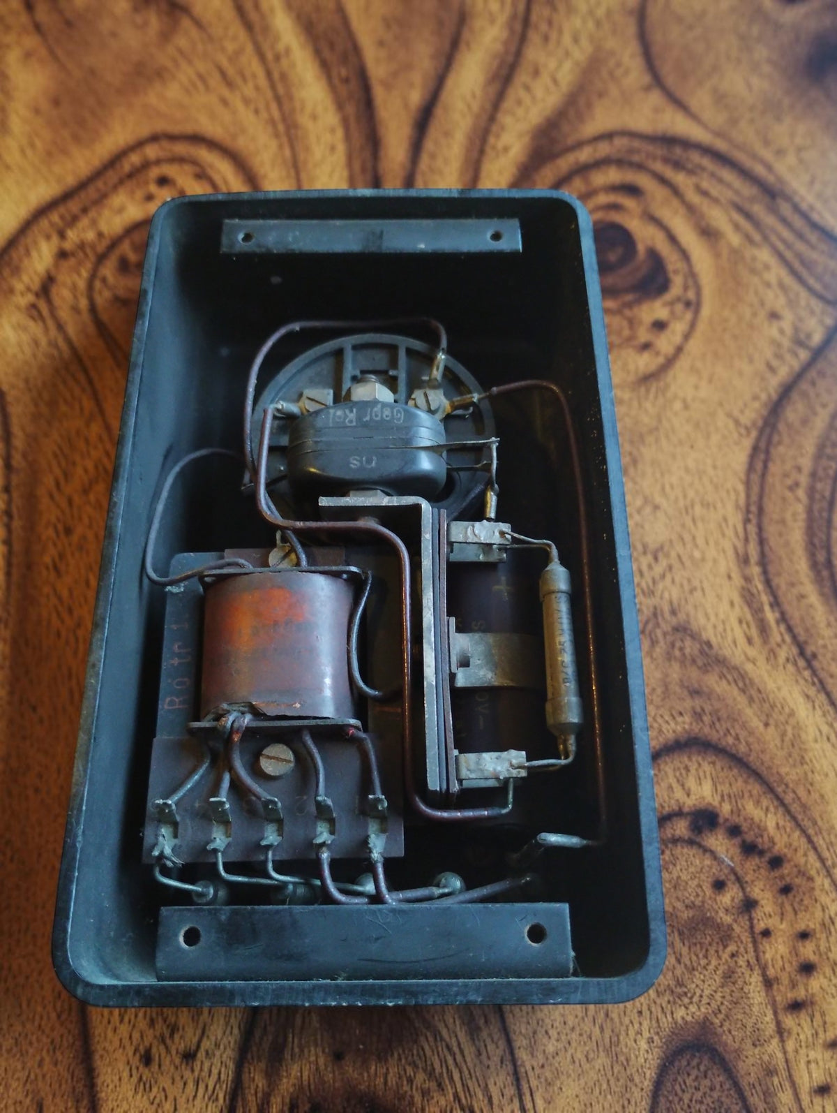 Open back of the Siemens & Halske vintage voltmeter showing internal coils, resistors, wiring and meter mechanism
