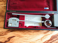 A. OTT Kempten Type 30 115 compensating polar planimeter in its open red-lined case with factory table and components

