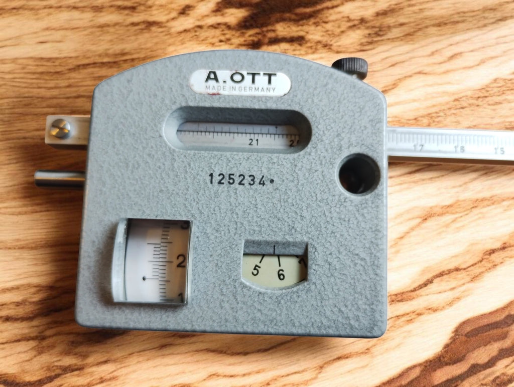 A. OTT planimeter measuring unit with gray finish, reading windows and engraved serial number 125234
