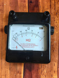 Vintage Gossen analog insulation tester with black Bakelite case, dual Ω and MΩ scales, and screw terminals
