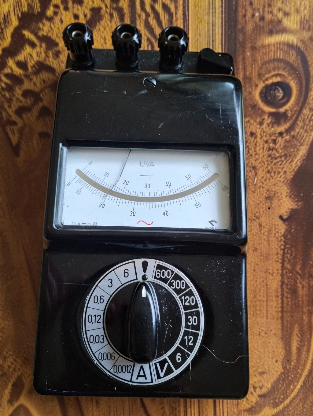 Gossen UVA analog multimeter with black housing, needle display and silver-and-black range selector.
