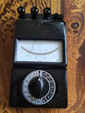 Gossen UVA analog multimeter with black housing, needle display and silver-and-black range selector.
