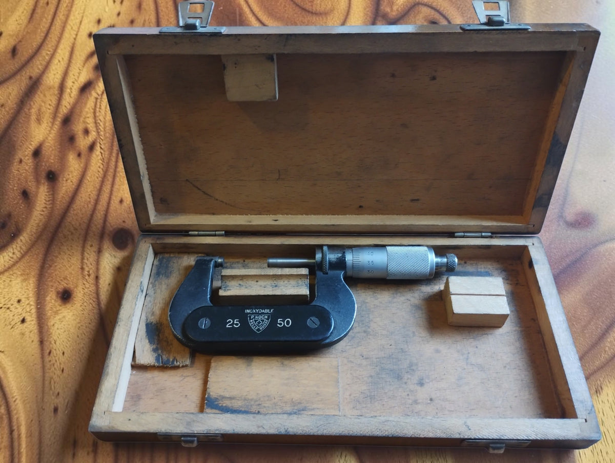 P. Roch 25–50 mm outside micrometer inside its open wooden storage case
