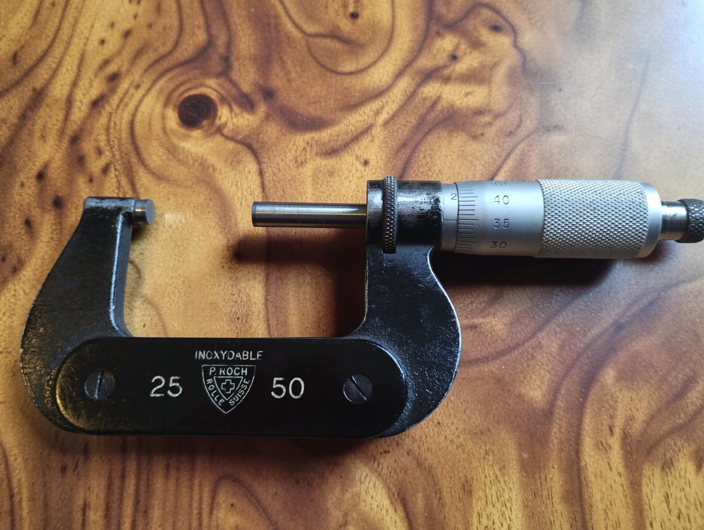 P. Roch Rolle Suisse 25–50 mm outside micrometer with black frame and silver-colored measuring thimble
