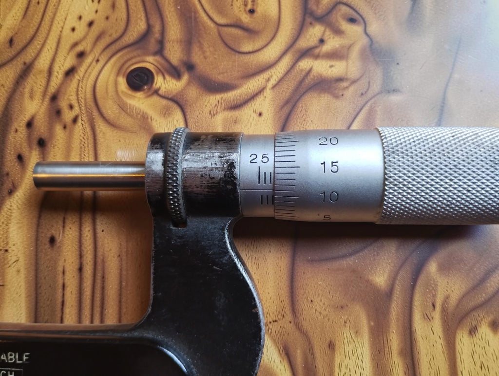 Close-up of the P. Roch micrometer’s graduated sleeve, measuring thimble and spindle
