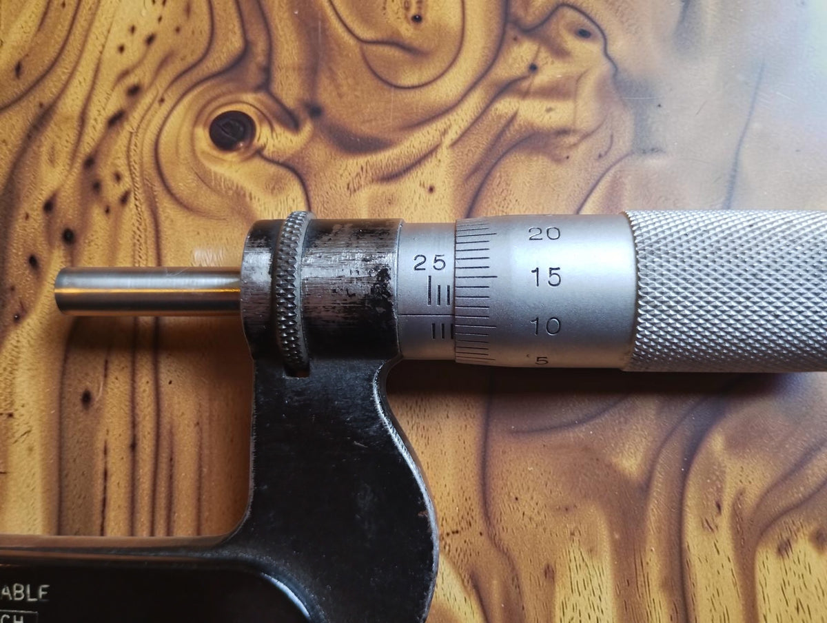 Close-up of the P. Roch micrometer’s graduated sleeve, measuring thimble and spindle
