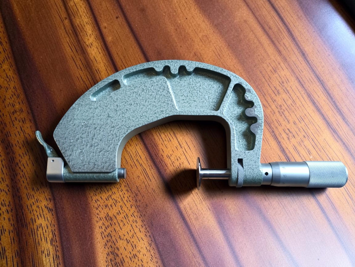 Rear view of the Mymeter 50–75 mm indicating micrometer with green hammer-finish frame.
