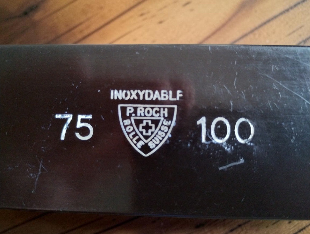 P. Roch Rolle Suisse shield logo with Swiss cross, Inoxydable marking and 75–100 range markings
