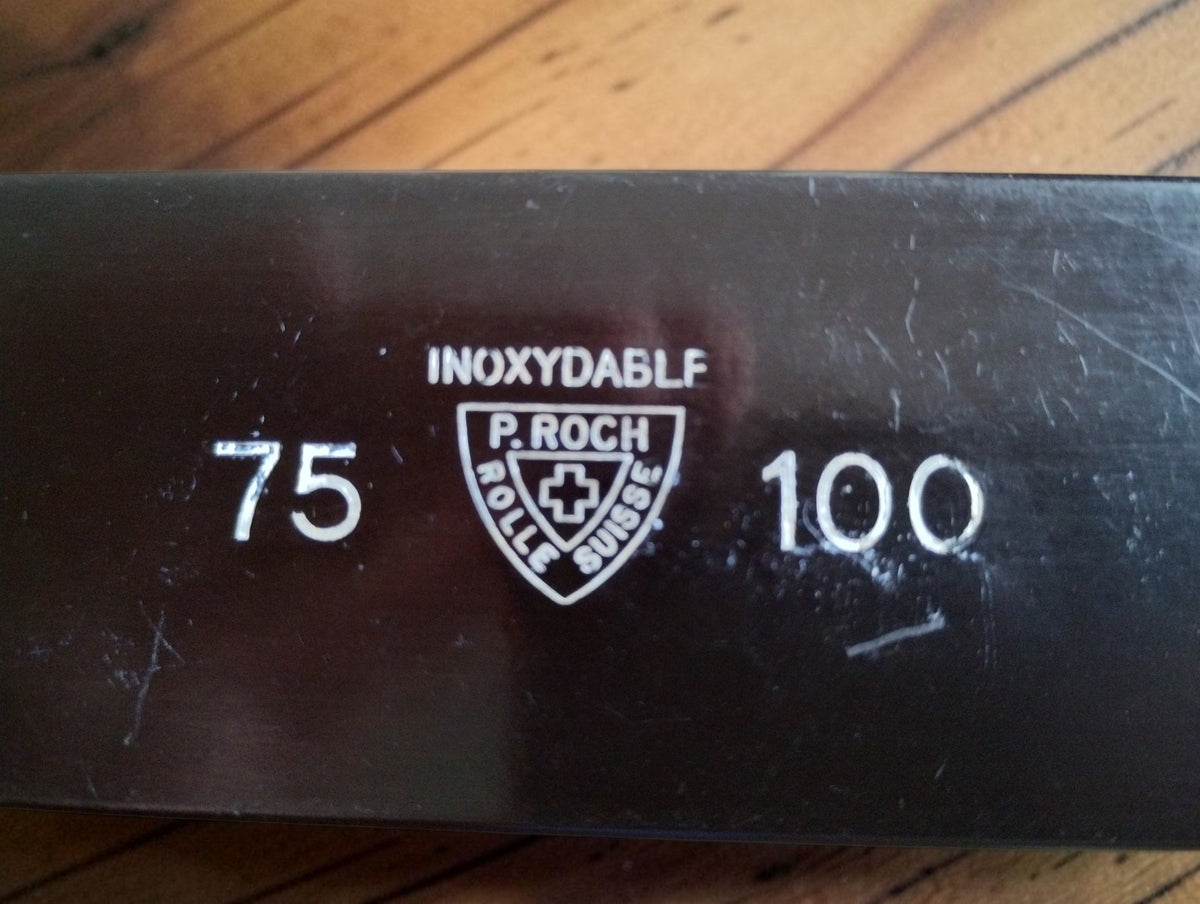 P. Roch Rolle Suisse shield logo with Swiss cross, Inoxydable marking and 75–100 range markings

