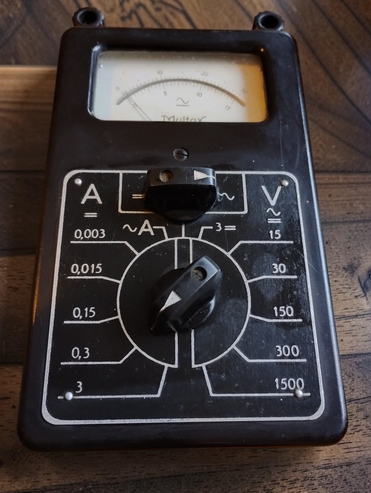 Multax Berger vintage analog multimeter with rotary selector switches and black housing, front view
