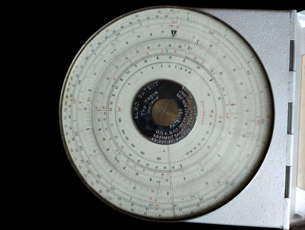 ALRO Patent System 200R circular slide rule with concentric scales and central patent plate in its metal housing.
