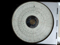 ALRO Patent System 200R circular slide rule with concentric scales and central patent plate in its metal housing.
