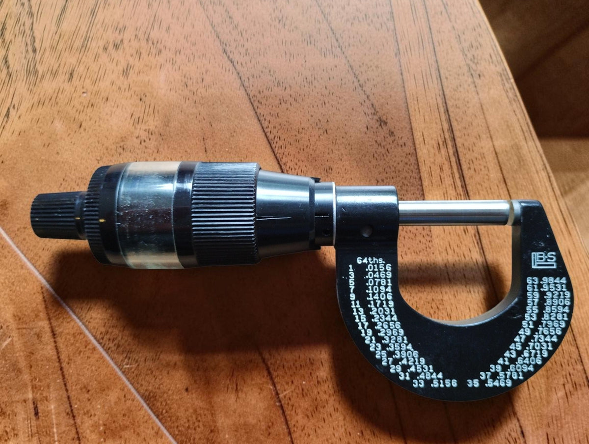 Opposite side of the Brown & Sharpe No. 10 outside micrometer with B&S logo and fractional inch conversion chart
