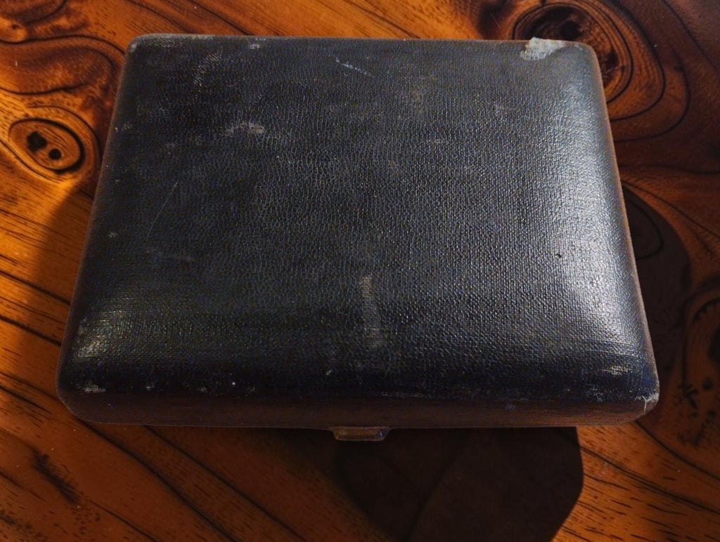 Closed black carrying case for the Hasler Bern hand tachometer, showing wear to the exterior
