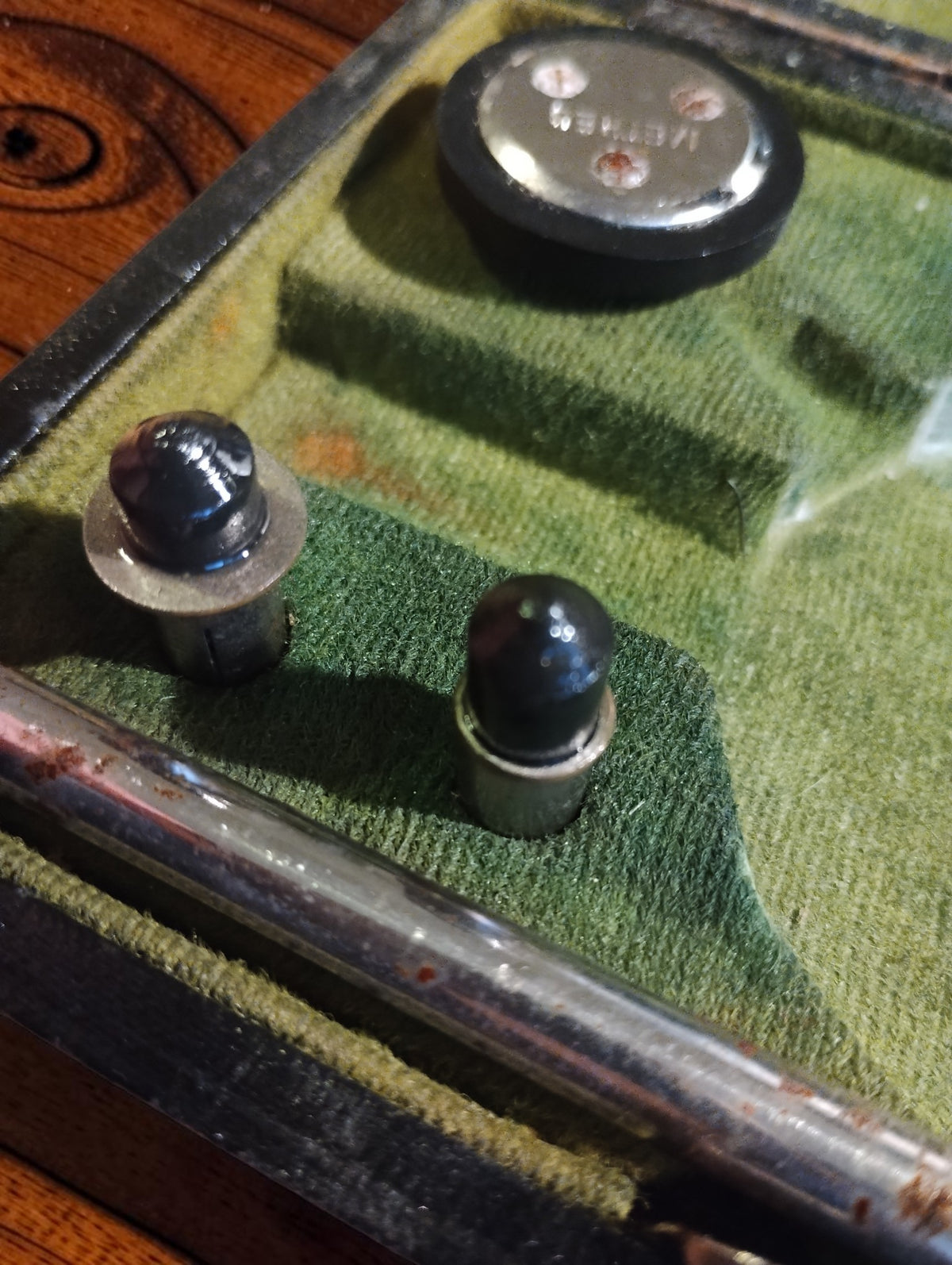 Close-up of contact tips and accessories in the green-lined Hasler Bern tachometer case
