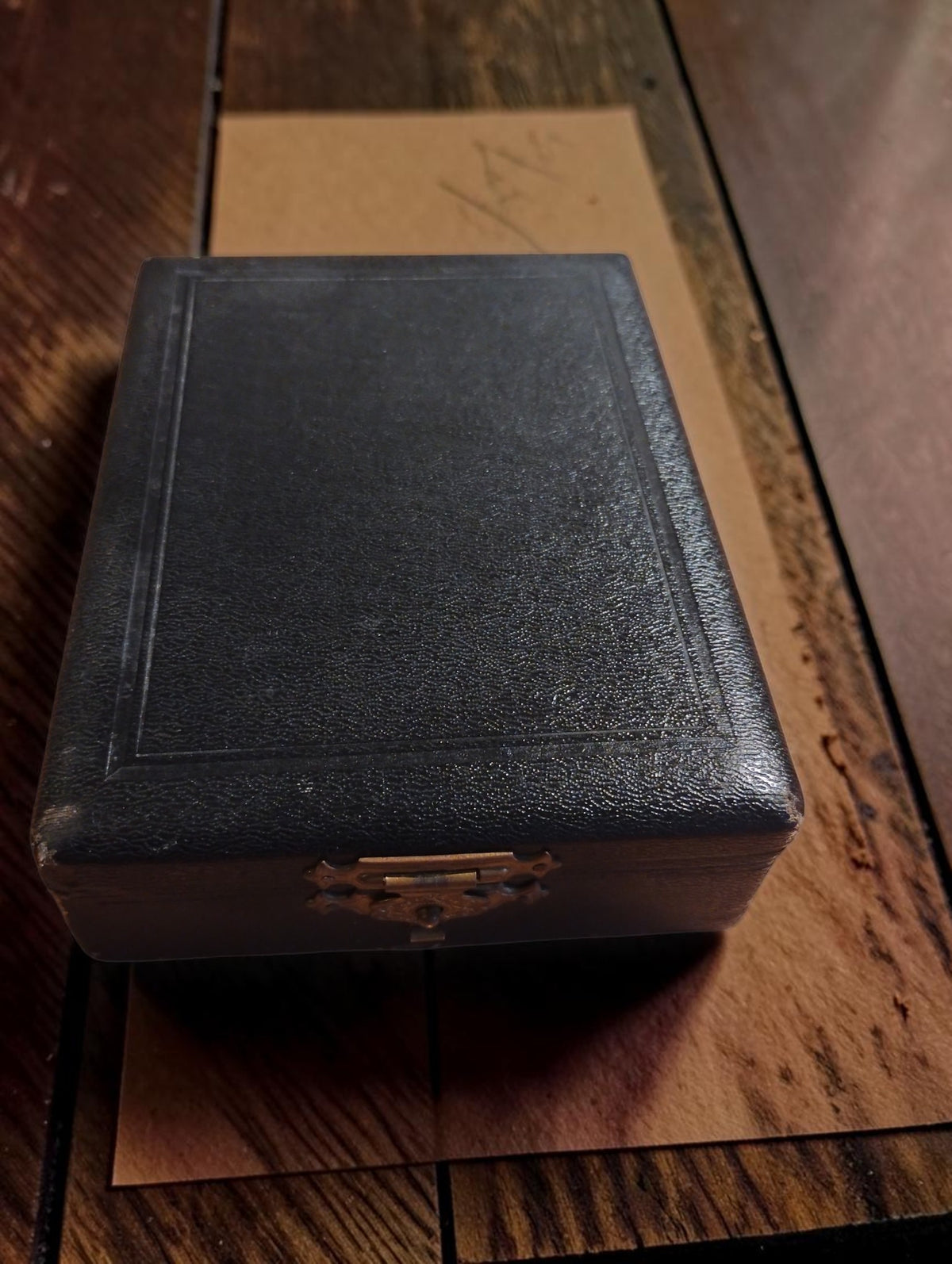 Closed black textured storage case with a metal clasp for the N. Zivy & Cie chronometric hand tachometer

