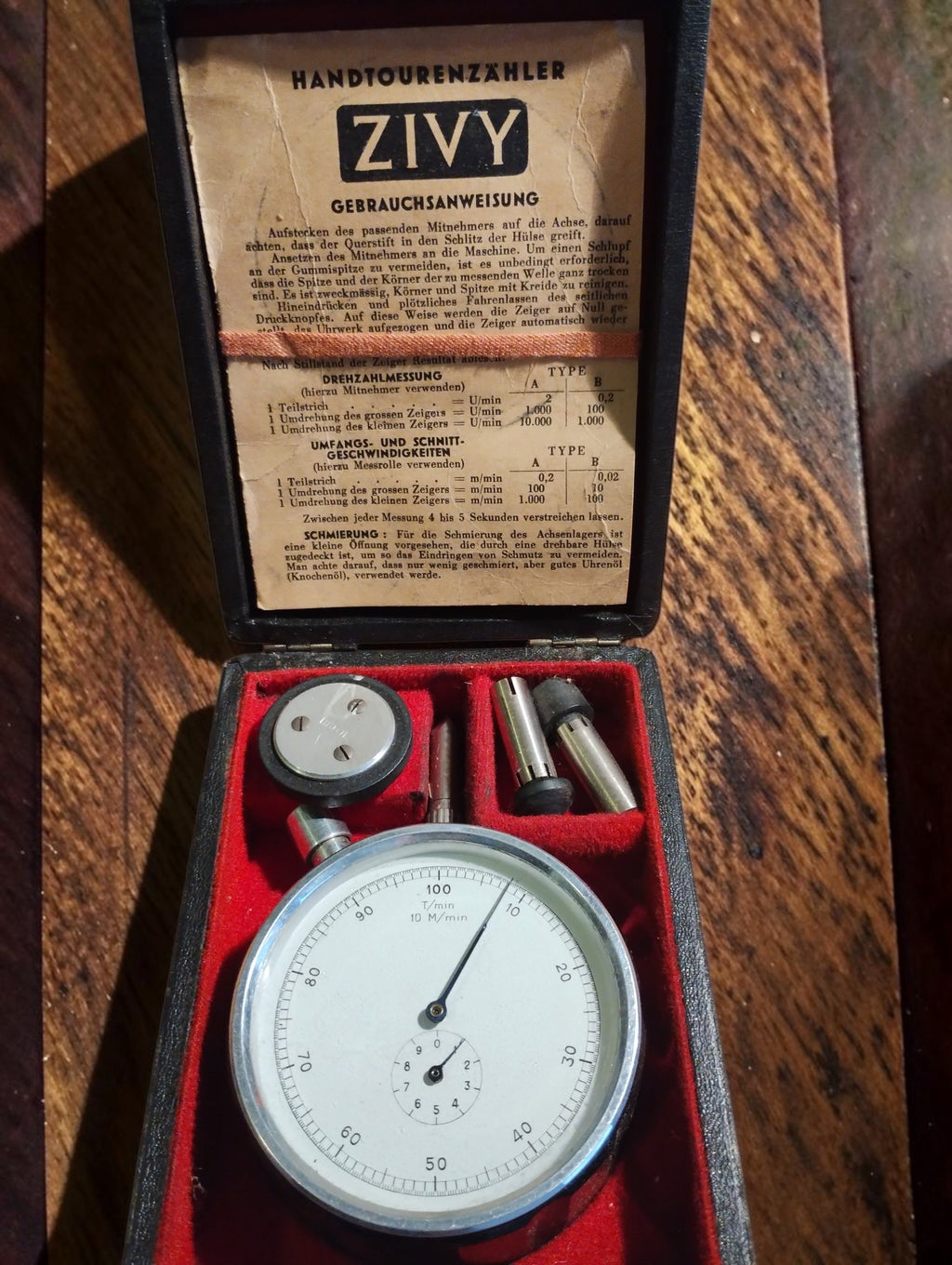 N. Zivy & Cie chronometric hand tachometer in a red-lined case with attachments and German instructions inside the lid
