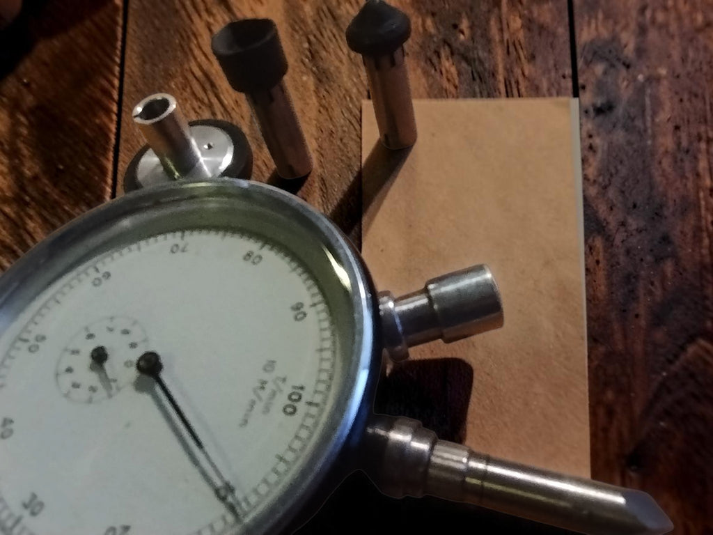 N. Zivy & Cie mechanical hand tachometer with metal contact attachments and rubber-tipped adapters
