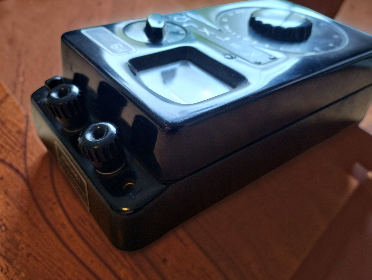 Angled side view of the Hartmann & Braun Pontavi Wheatstone bridge showing its black bakelite case and terminals
